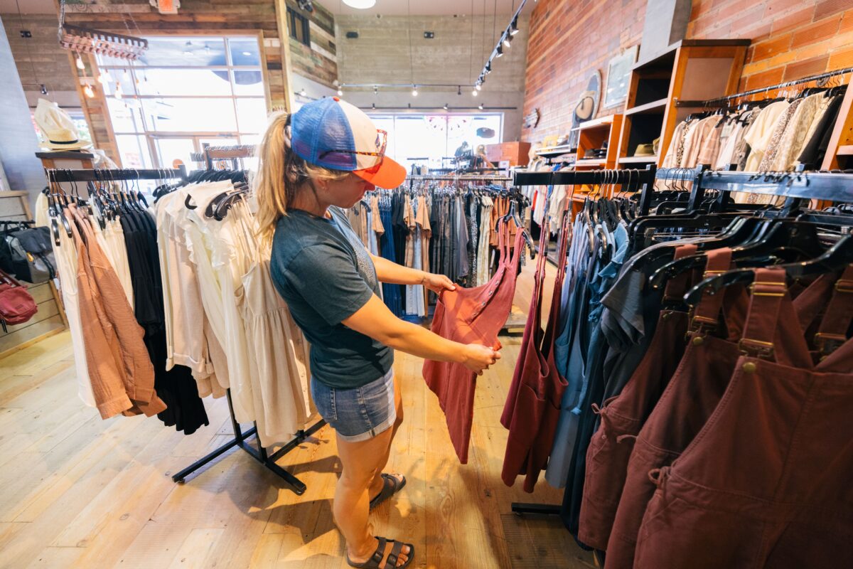 Person looking at seasonal clothing in a downtown Kalispell shop