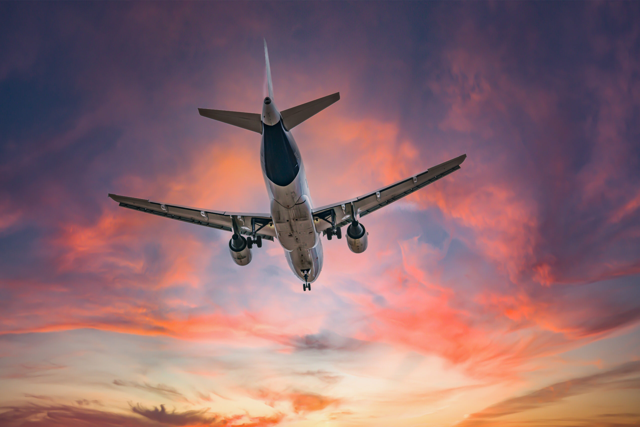 Airplane in the sky at sunrise